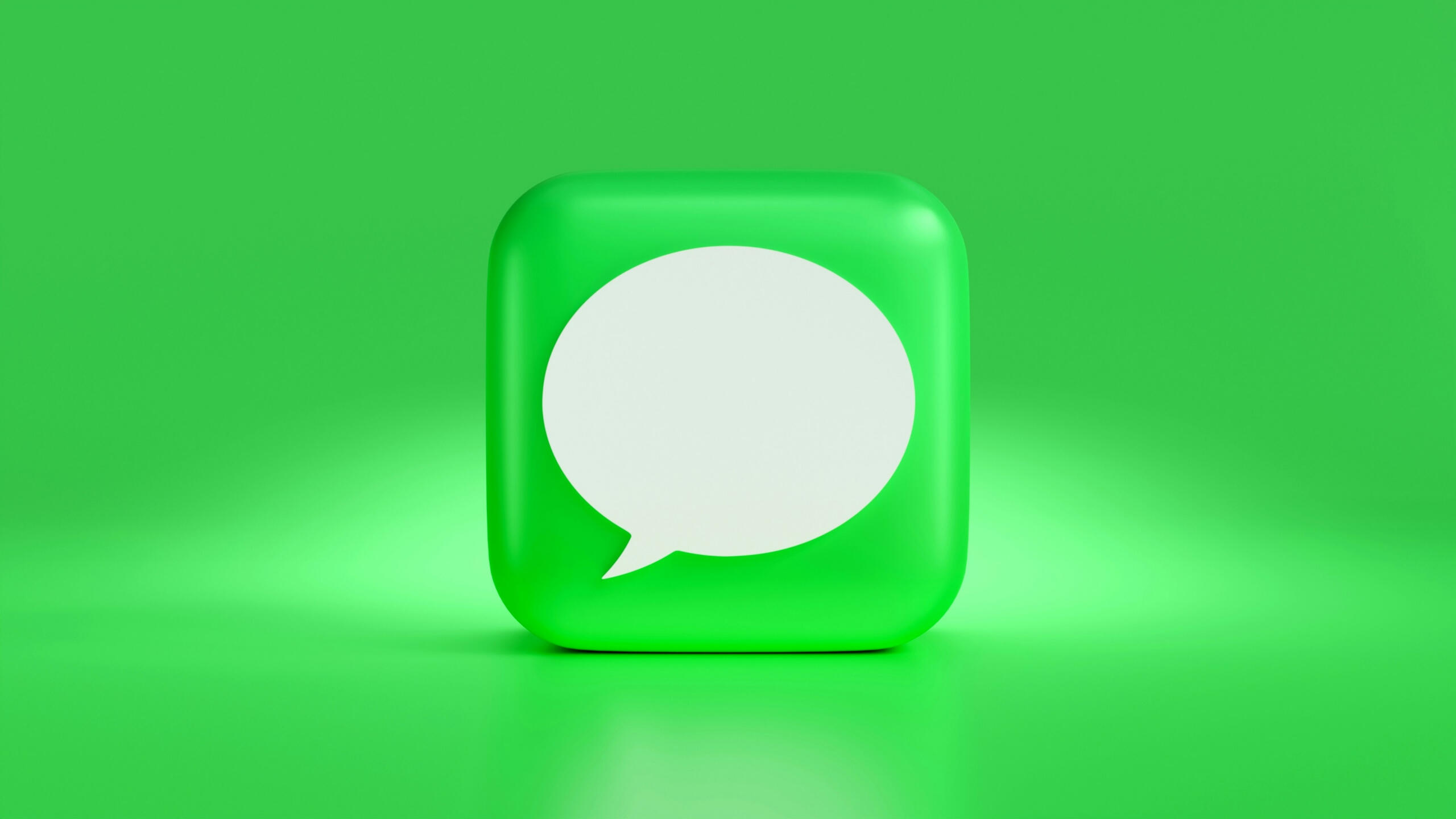 A green square with a white speech bubble.